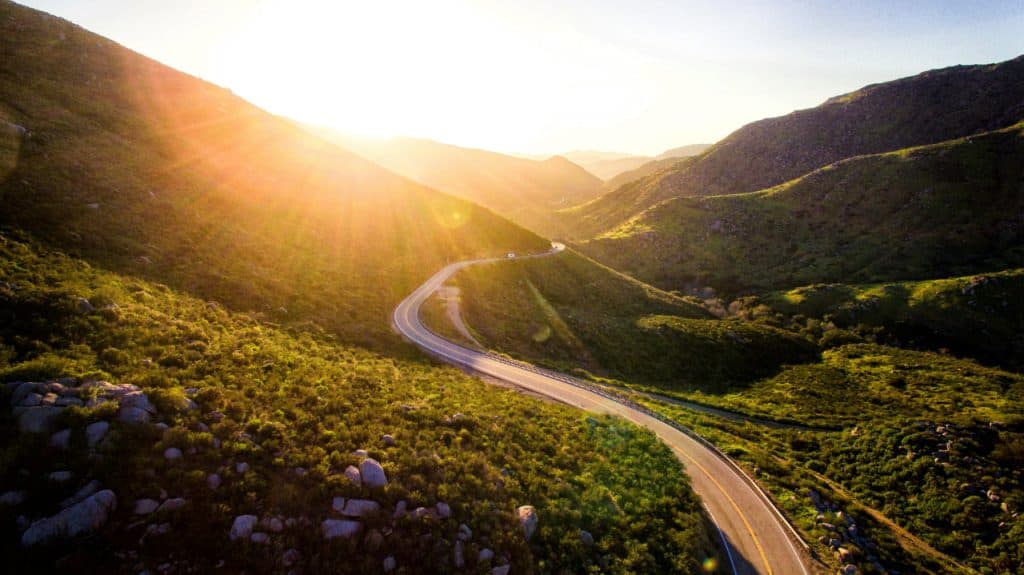 Winding road thru mountains in the country